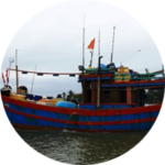 A blue and red fishing boat in the water with Keywords for optimal SEO.