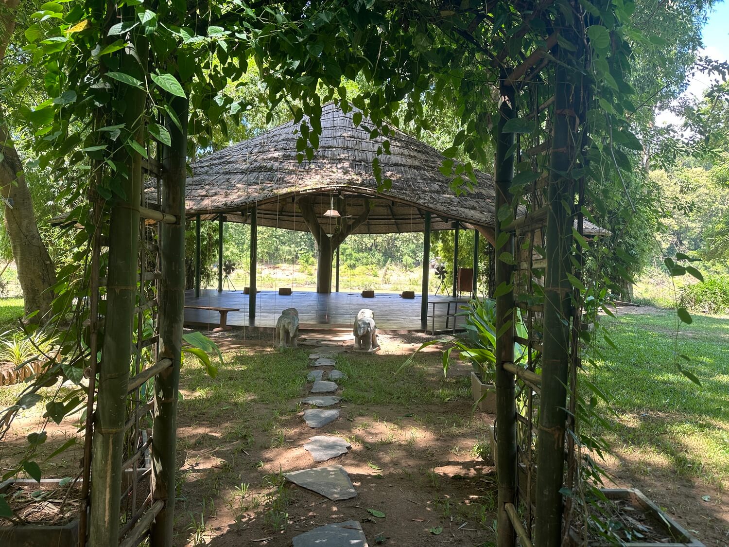 A gazebo in the middle of a grassy area in Luang Prabang.
