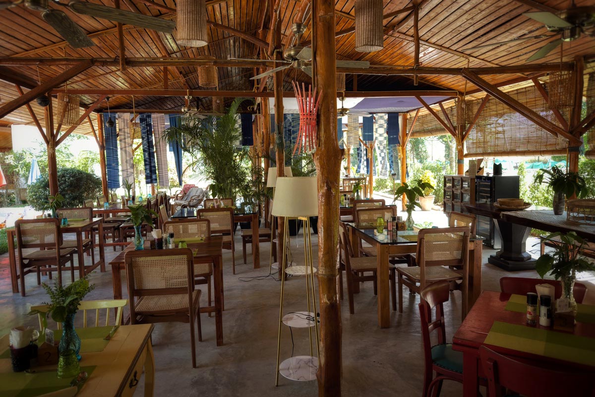A farm-themed restaurant with rustic wooden tables and chairs.