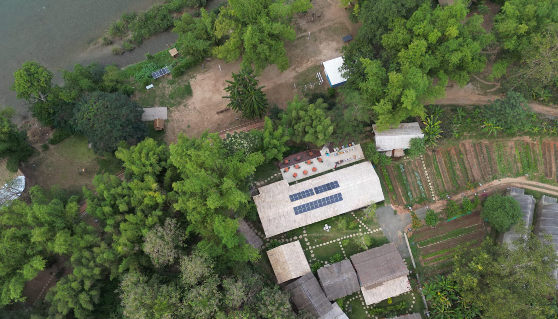 About: An aerial view of a house near a river.