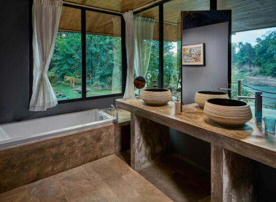 Luang Prabang: A bathroom with two sinks and a bathtub.