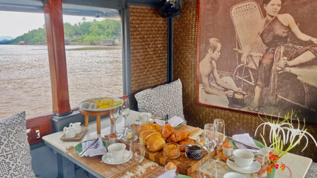 Breakfast on a boat in Luang Prabang, overlooking the Mekong River.